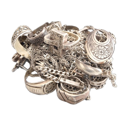 A pile of scrap silver jewelry, including rings, chains, and pendants, ready for recycling or resale at the best market price