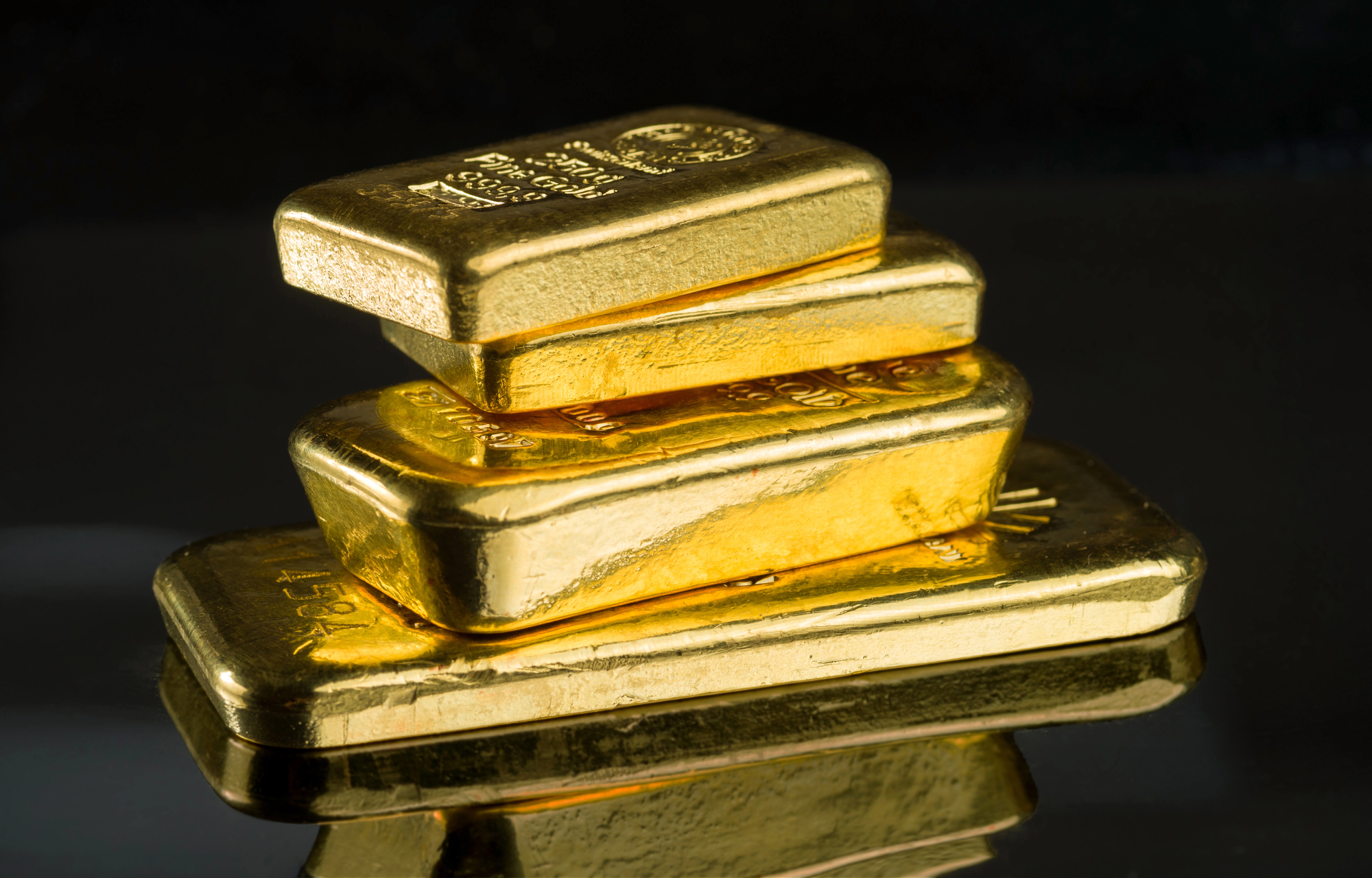 A stack of gleaming gold bars arranged neatly on top of one another